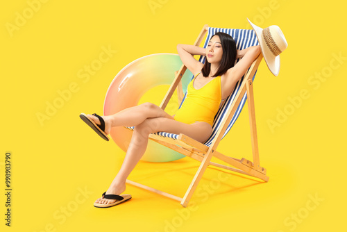 Beautiful Asian woman relax...