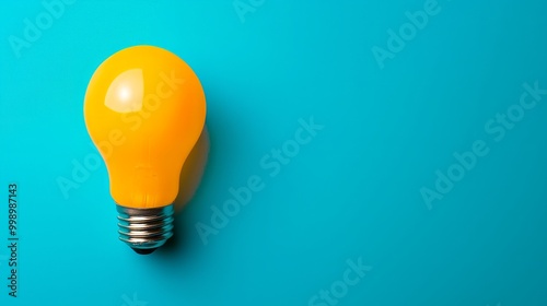 light bulb isolated on orange background. idea and innovation concept