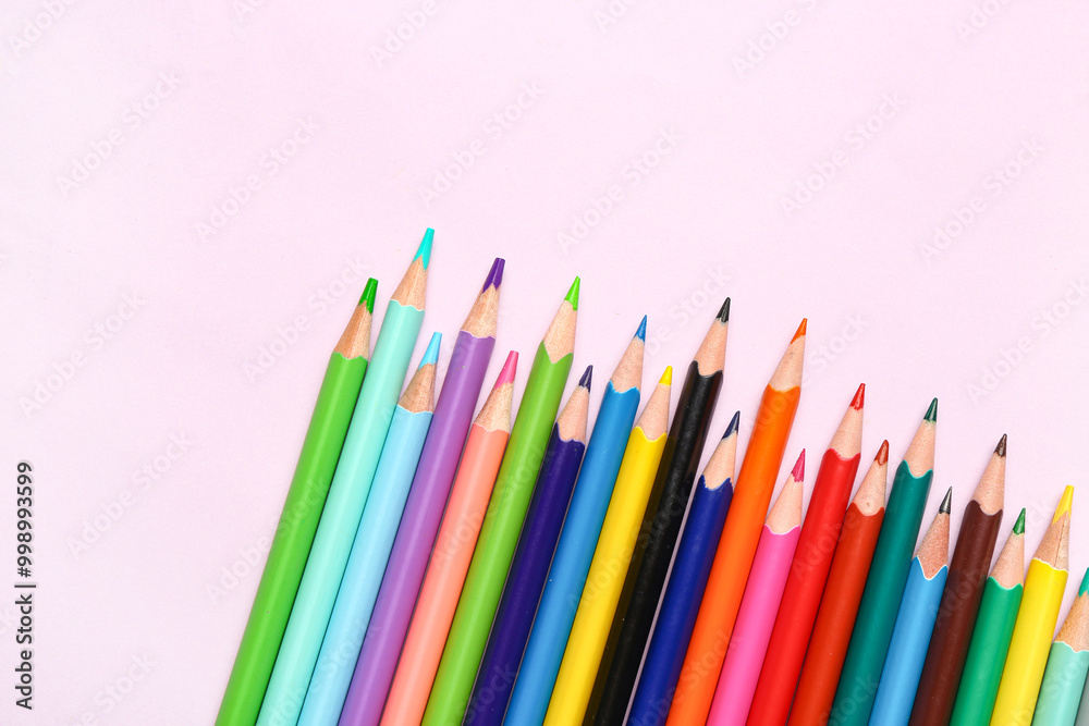 Group of colorful pencils on light pink background Group of colorful pencils on light pink background