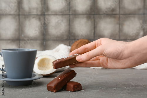 Hand placing chocolate coco...