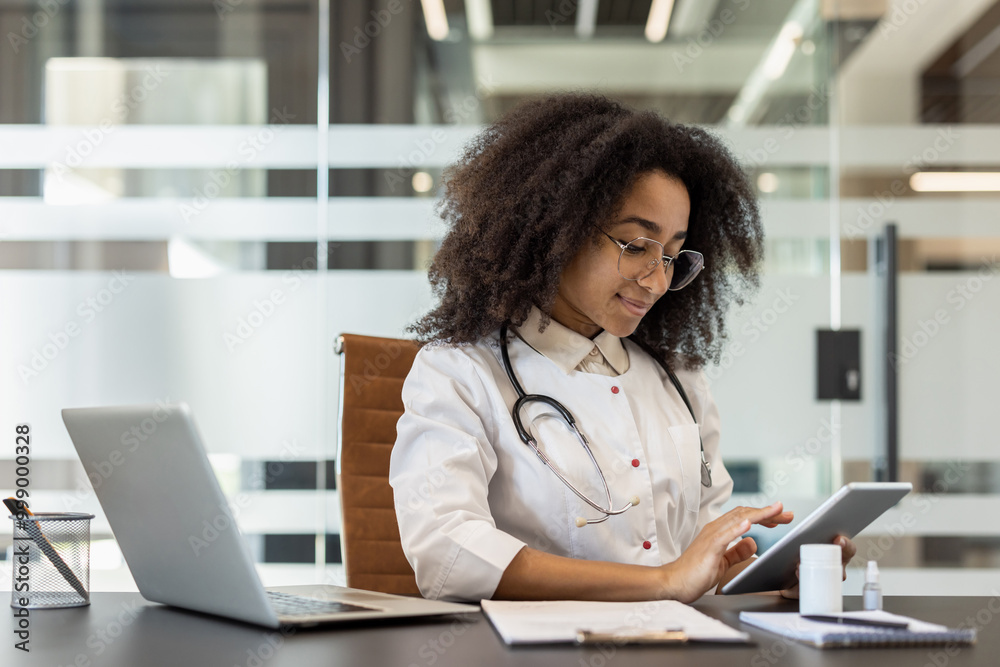 Confident female doctor using tablet in modern office setting for medical research and patient management Confident female doctor using tablet in modern office setting for medical research and patient management