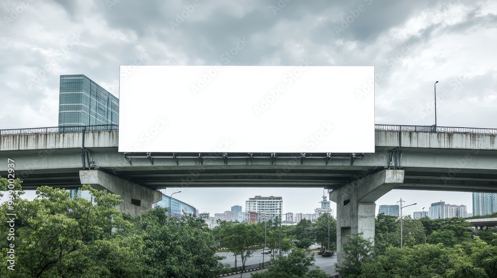 Blank Billboard on Modern Overpass against Cloudy Sky Blank Billboard on Modern Overpass against Cloudy Sky