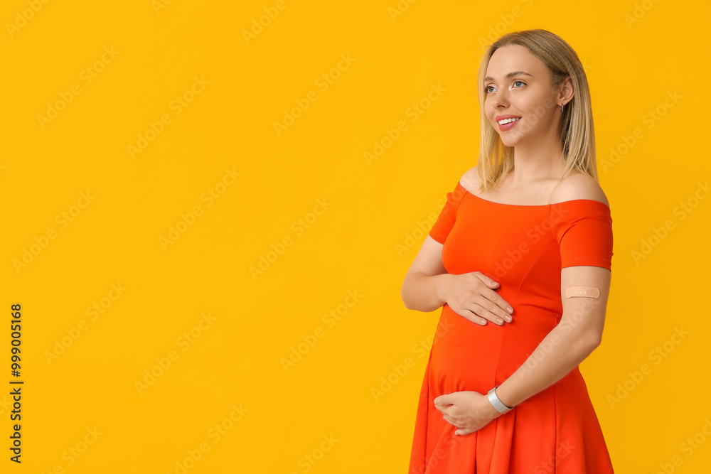 Obraz premium Young pregnant woman after vaccination on yellow background