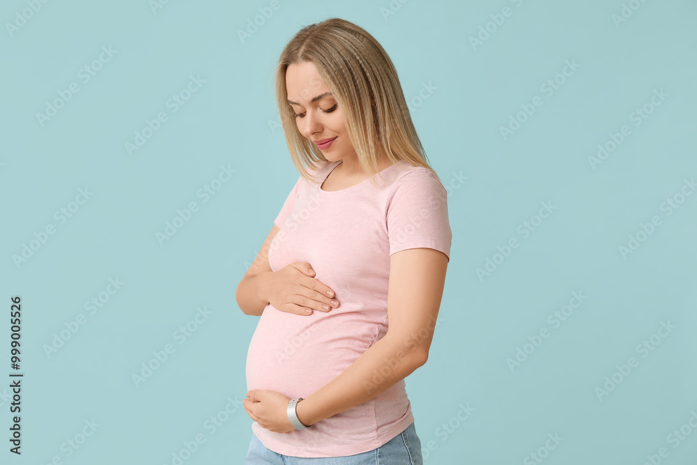 Happy pregnant woman on blue background Happy pregnant woman on blue background
