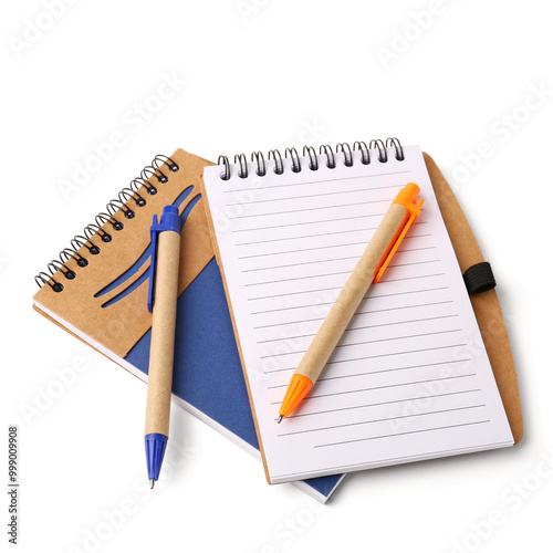 Stylish notebooks with pens on white background