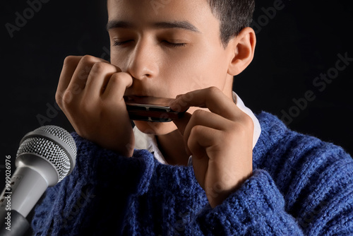 Teenage boy with microphone...