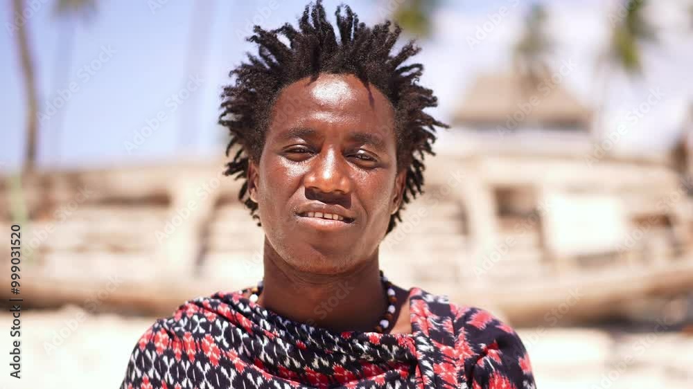 Portrait of Maasai man, traditional outfit, African warrior tribesman on beach. Tropical island beach in Tanzania. tourism destination in Africa. Portrait of Maasai man, traditional outfit, African warrior tribesman on beach. Tropical island beach in Tanzania. tourism destination in Africa.