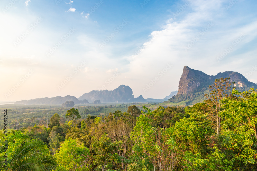 Panoramic view from the Din Daeng Doi viewpoint. Endless wide valley with hills covered with tropical forests, pointed cliffs. Panoramic view from the Din Daeng Doi viewpoint. Endless wide valley with hills covered with tropical forests, pointed cliffs.