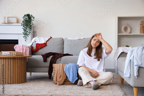 Tired young woman sorting d...