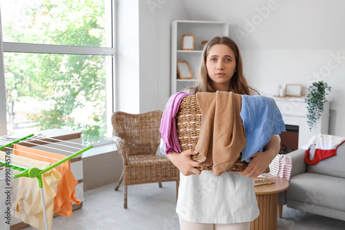 Young woman holding basket ...