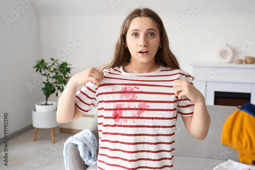 Shocked young woman in stai...
