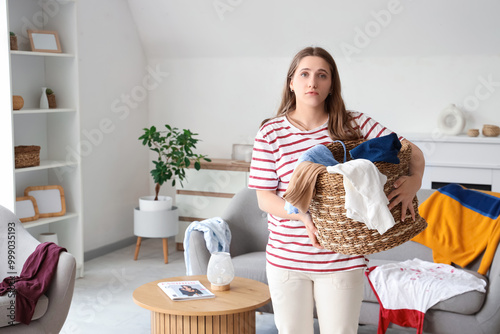 Young woman holding basket ...