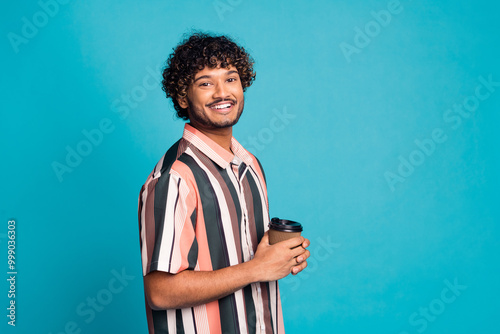 Profile photo of nice young man hold coffee empty space wear shirt isolated on teal color background photo