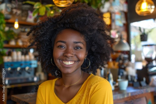 Portrait of a smiling young woman in coffee shop