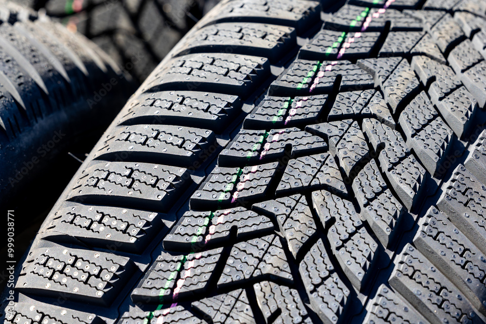 Sharp tread of new winter tires ready for the seasonal change. New tires are important for increasing road safety