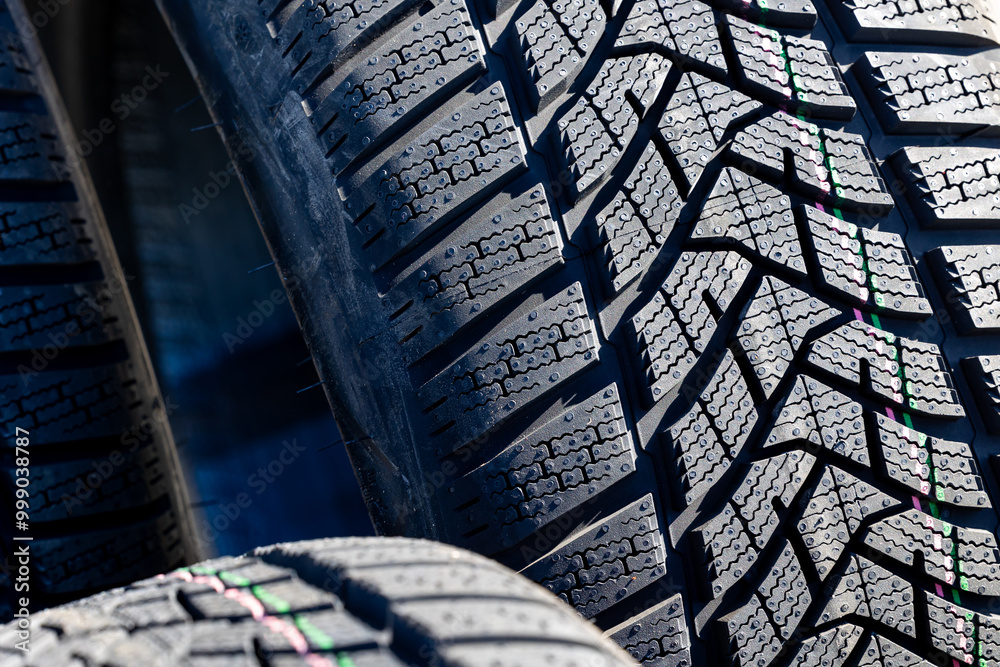 Sharp tread of new winter tires ready for the seasonal change. New tires are important for increasing road safety