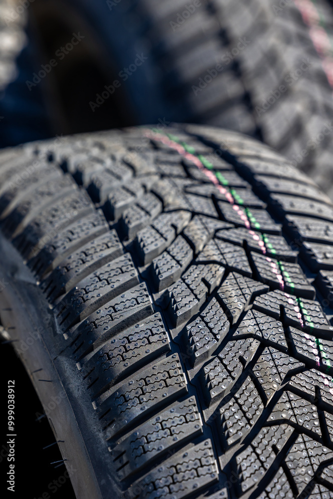 Sharp tread of new winter tires ready for the seasonal change. New tires are important for increasing road safety