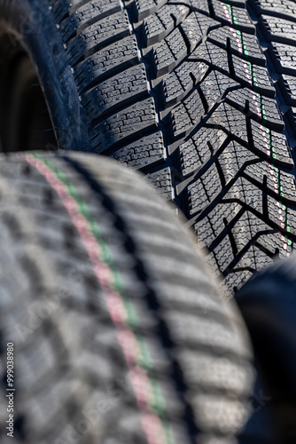Obraz na płótnie Sharp tread of new winter tires ready for the seasonal change. New tires are important for increasing road safety w salonie