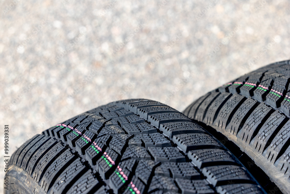 Sharp tread of new winter tires ready for the seasonal change. New tires are important for increasing road safety
