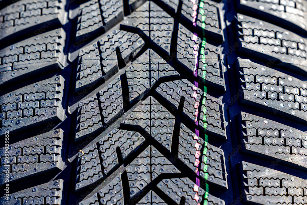 Sharp tread of new winter tires ready for the seasonal change. New tires are important for increasing road safety