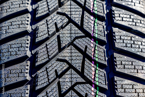 Obraz na płótnie Sharp tread of new winter tires ready for the seasonal change. New tires are important for increasing road safety w salonie