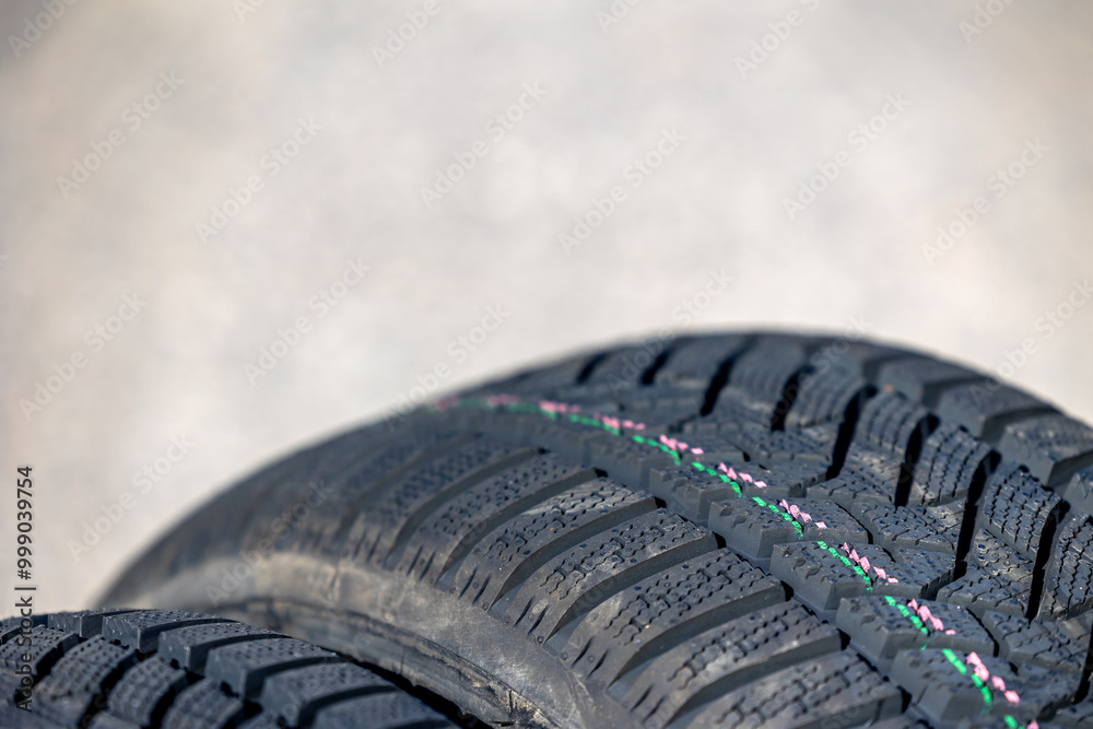 Sharp tread of new winter tires ready for the seasonal change. New tires are important for increasing road safety