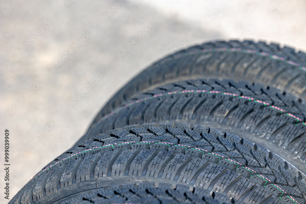 Sharp tread of new winter tires ready for the seasonal change. New tires are important for increasing road safety