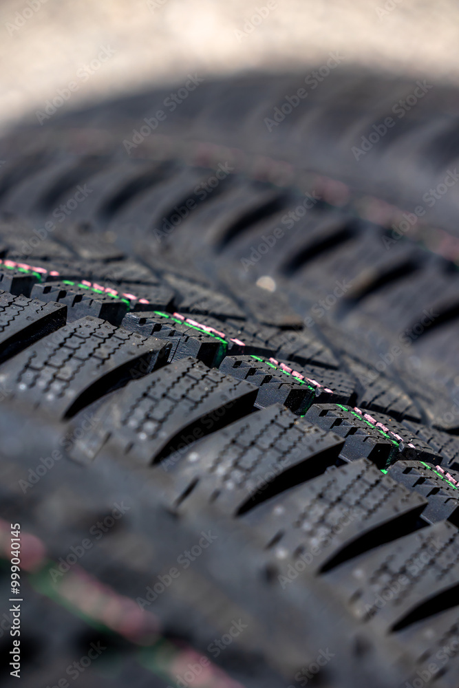 Sharp tread of new winter tires ready for the seasonal change. New tires are important for increasing road safety