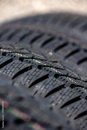 Obraz na płótnie Sharp tread of new winter tires ready for the seasonal change. New tires are important for increasing road safety w salonie