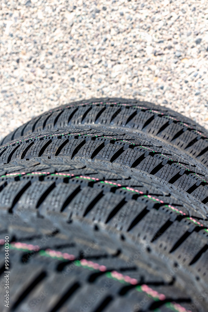 Sharp tread of new winter tires ready for the seasonal change. New tires are important for increasing road safety