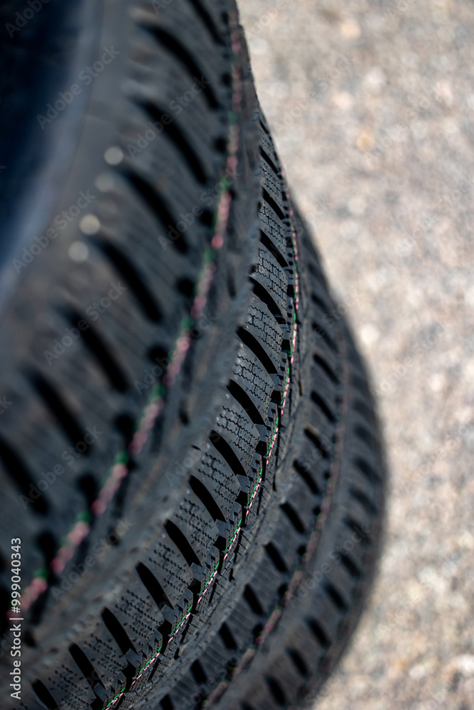 Sharp tread of new winter tires ready for the seasonal change. New tires are important for increasing road safety