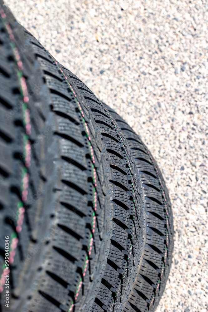 Sharp tread of new winter tires ready for the seasonal change. New tires are important for increasing road safety