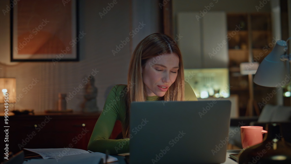 Businesswoman talking late videocall by laptop worried work problem close up. Businesswoman talking late videocall by laptop worried work problem close up.