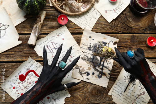 Bloody black witch hands wi...
