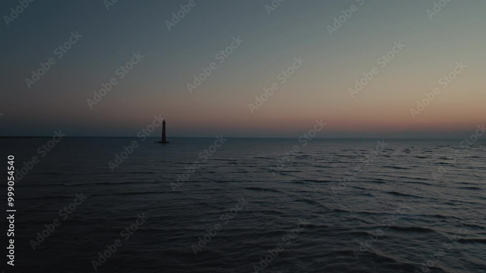 A lighthouse on the Pacific Ocean coast of South Carolina during sunrise A lighthouse on the Pacific Ocean coast of South Carolina during sunrise