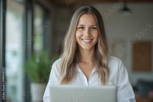 Free Download portrait of a young business woman working at a laptop - GFXLoad