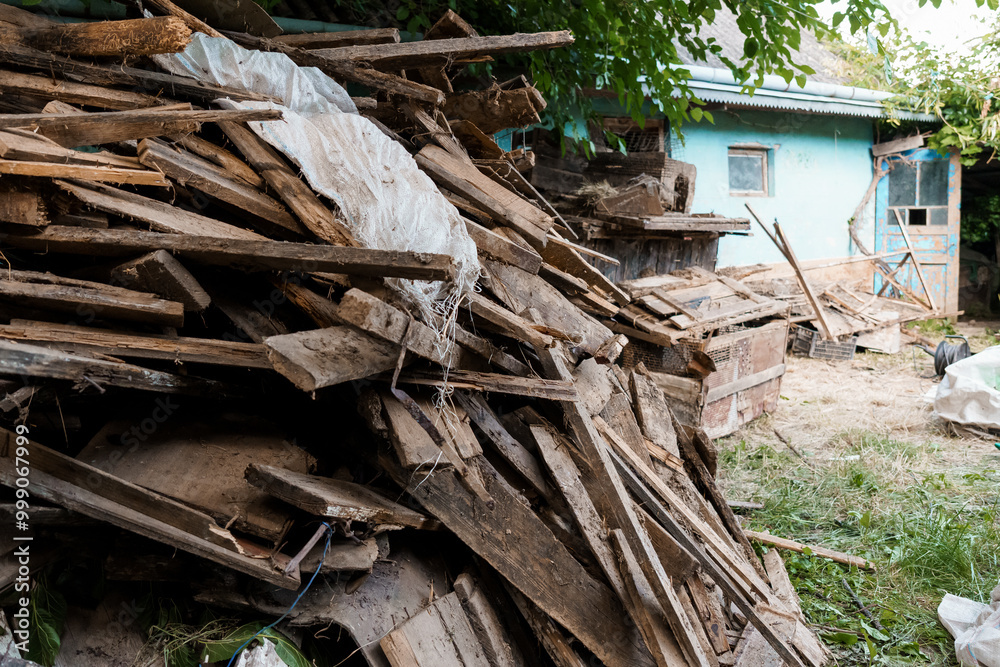 A Rustic Pile of Weathered Wooden Planks Surrounded by Nature's Touch A Rustic Pile of Weathered Wooden Planks Surrounded by Nature's Touch
