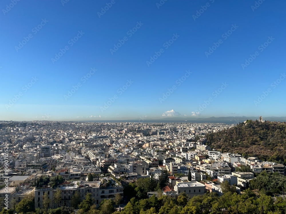 Fototapeta premium View from Athena Greece atop the Acropolis, city views from the top of famous ancient ruins. 