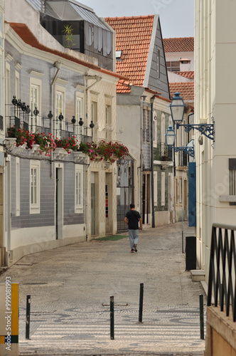 Pedestrian street in the city center of Aveiro in Portugal, with a person walking, old part of the city photo