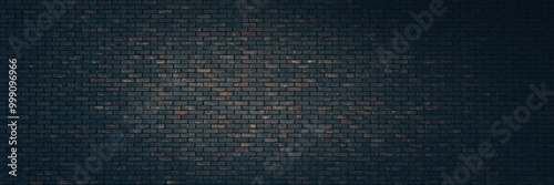 Dark brick wall with an aged and weathered texture in a dimly lit environment.