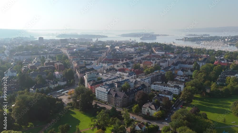 Aerial tracking shot from above Frogner Park toward Oslofjord and the centre