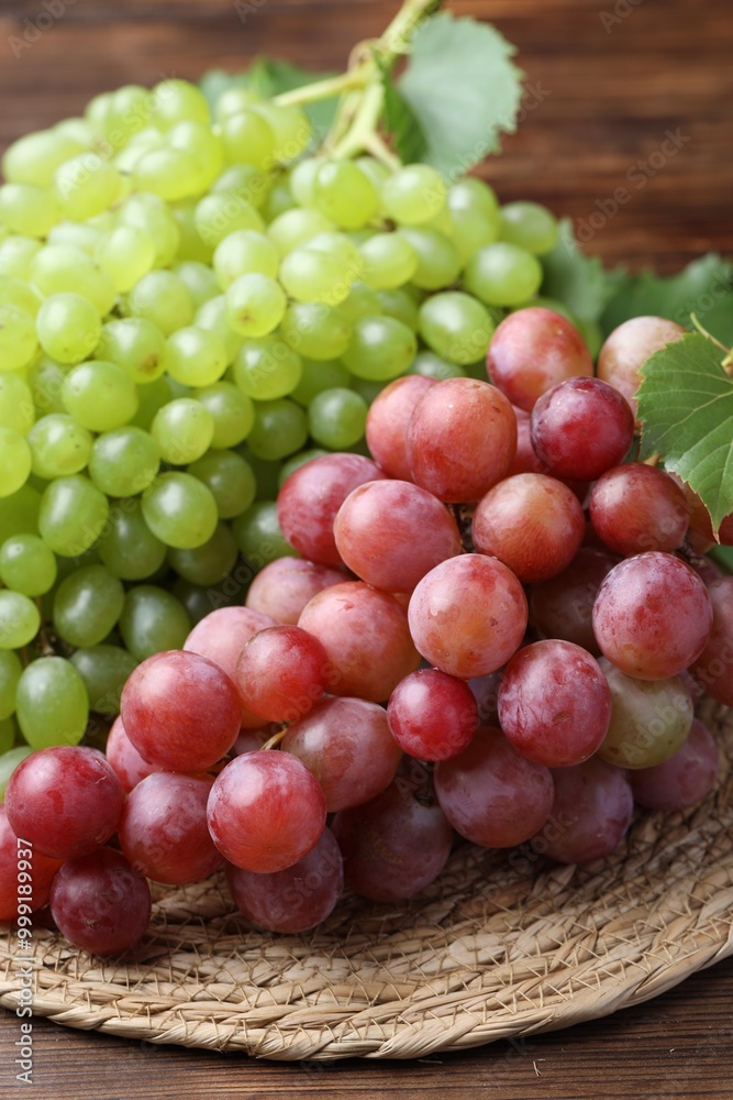 Fresh ripe grapes on wooden table, closeup Fresh ripe grapes on wooden table, closeup