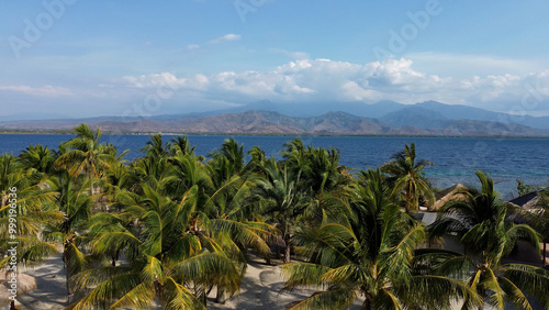 Small island Pulau Bedil, tropical island in Indonesia. Drone view.