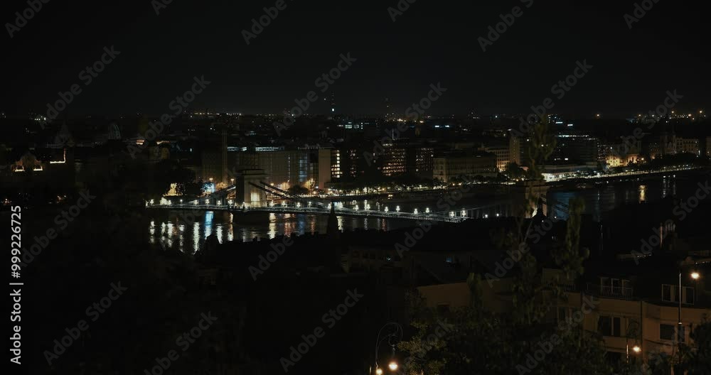 Floodwaters of the Danube reflecting city lights as Budapest's skyline glows at night Floodwaters of the Danube reflecting city lights as Budapest's skyline glows at night