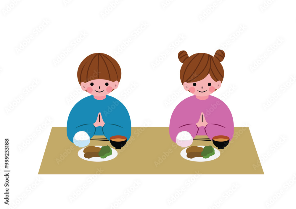 食事の前にいただきますをする男の子と女の子