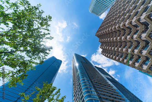 looking up view of city skyline in tokyo, japan photo