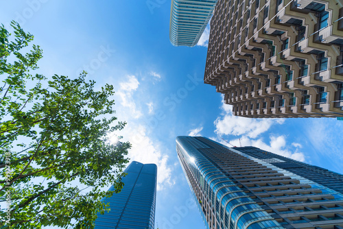 looking up view of city skyline in tokyo, japan photo