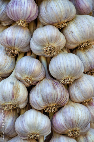 Close-up of hanging fresh garlic at a farmer's market