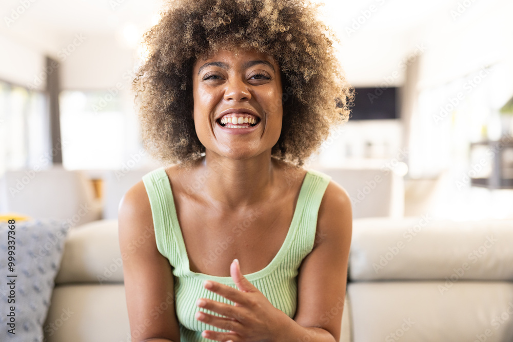 On video call, Smiling woman sitting on couch, at home On video call, Smiling woman sitting on couch, at home