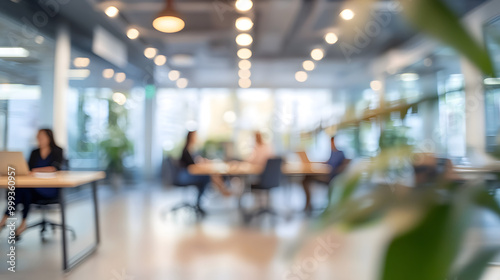 Business open modern office daytime daylight with blurred people in smart casual wear having a meeting. Working culture chill happy enjoy workplace work life balance plant women men employee